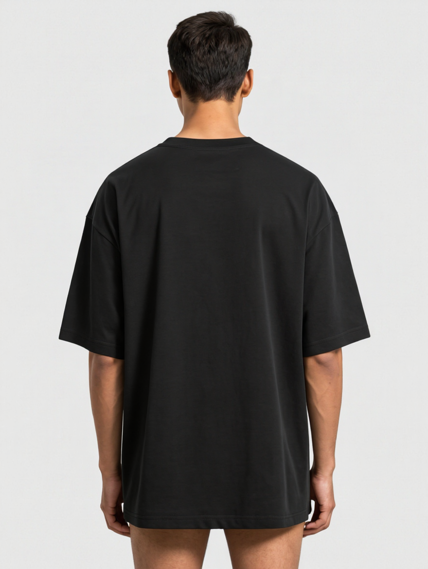 Model wearing I'm A Cockroach oversized tee, back view