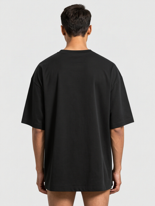 Model wearing I'm A Cockroach oversized tee, back view